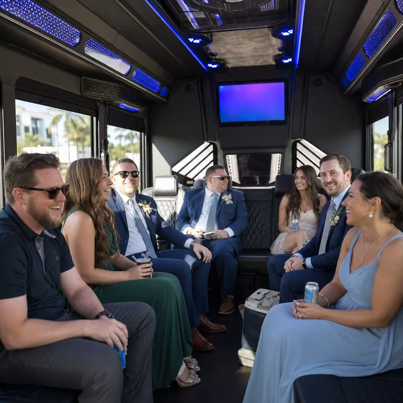 Wedding guests seated inside a Fort Myers party bus