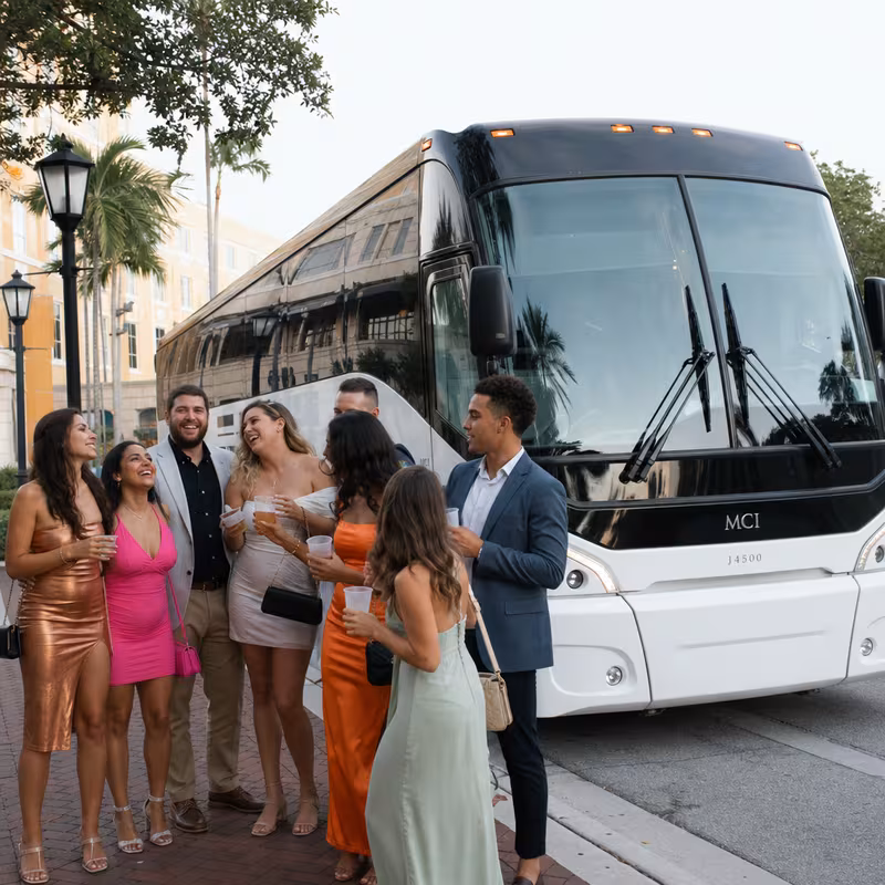 Passengers loading luggage while boarding an Fort Myers group shuttle