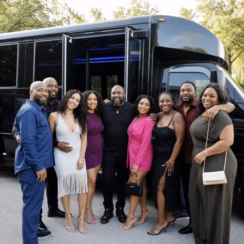Group boarding a white charter bus for Birthday Transportation transportation in Fort Myers