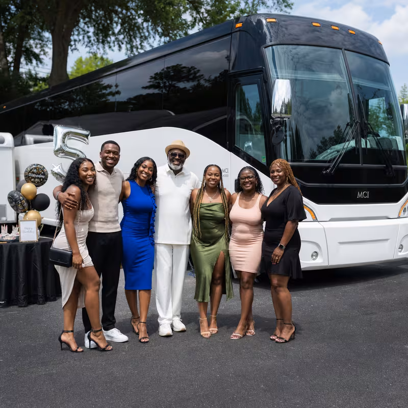 Passengers loading luggage while boarding an Fort Myers group shuttle
