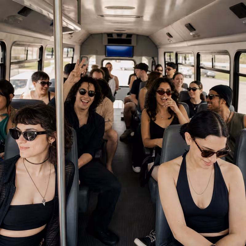Party bus interior with wraparound leather seating and LED lighting in Fort Myers