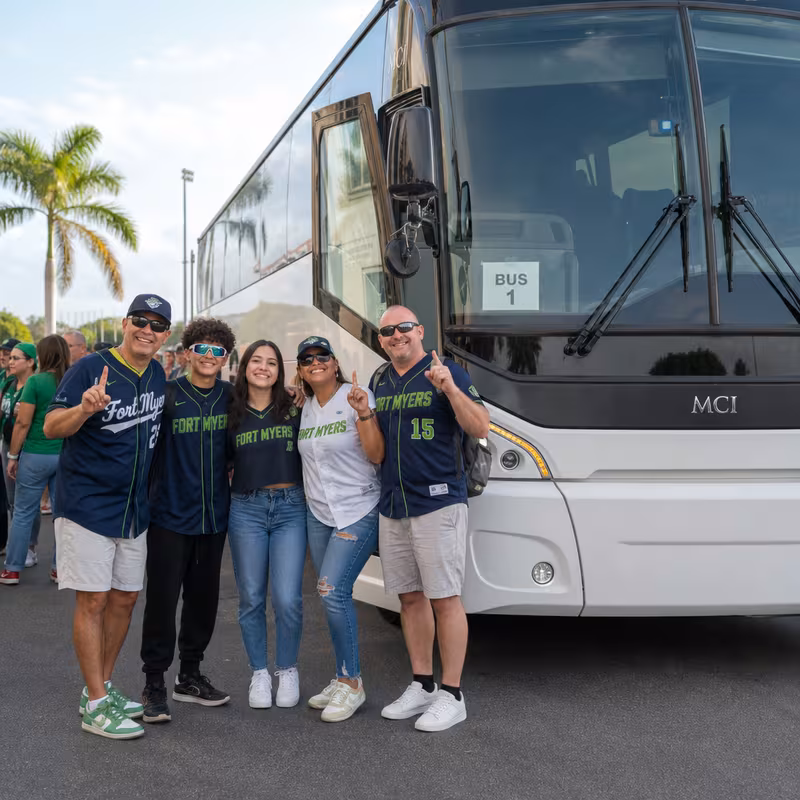 Passengers loading luggage while boarding an Fort Myers group shuttle