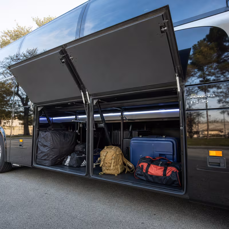 Party bus interior with wraparound leather seating and LED lighting in Fort Myers